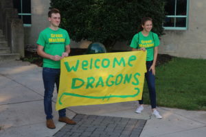 2 Students holding Welcome Banner
