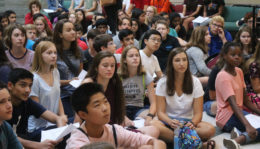 Students sitting on floor