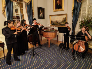 Students perform music at the Governor's mansion