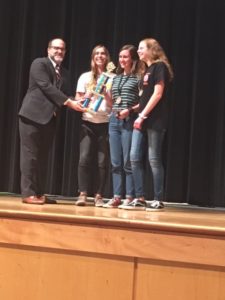 3 students receiving team award