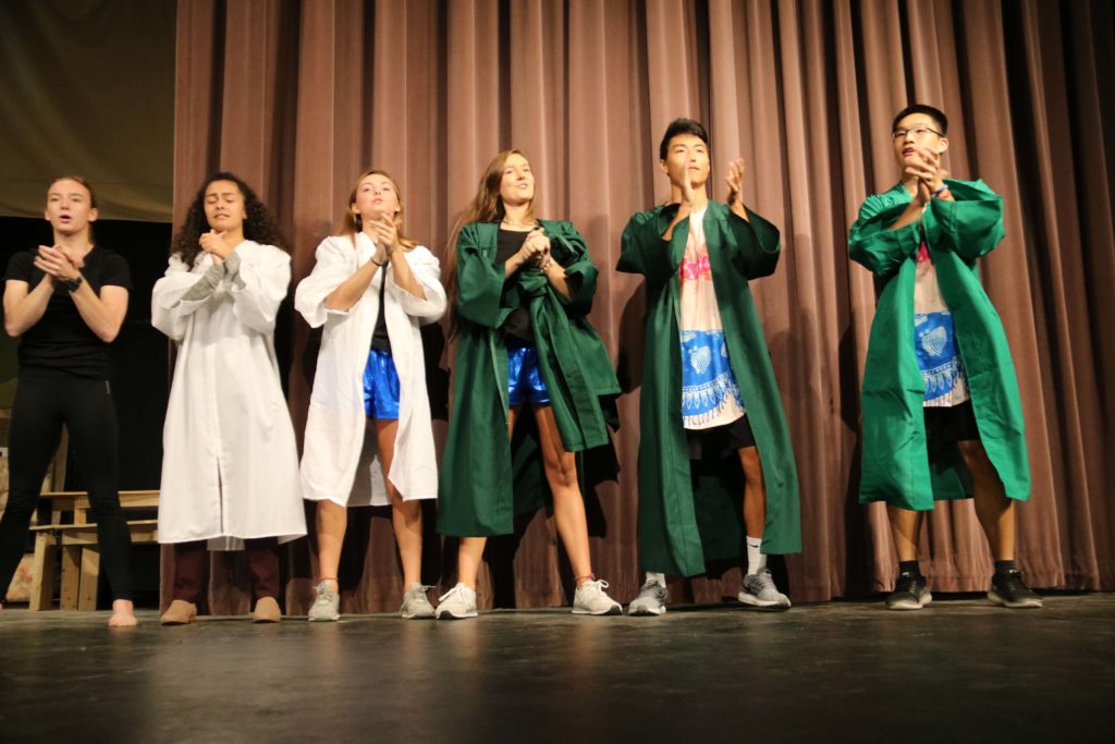 Students performing on the stage