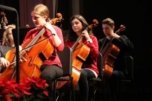 Students playing cellos