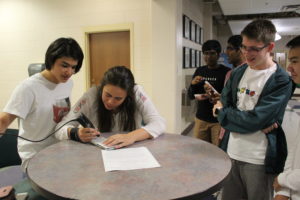 Students engraving their phone