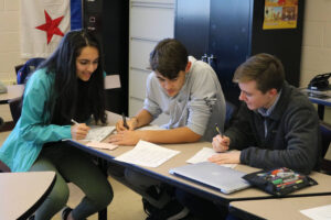 3 students at table