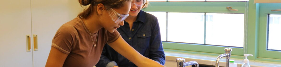 Two female students working in a science lab