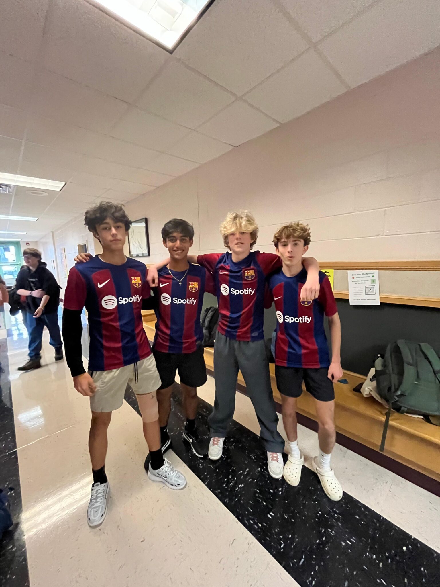 4 boys soccer players in their jersey