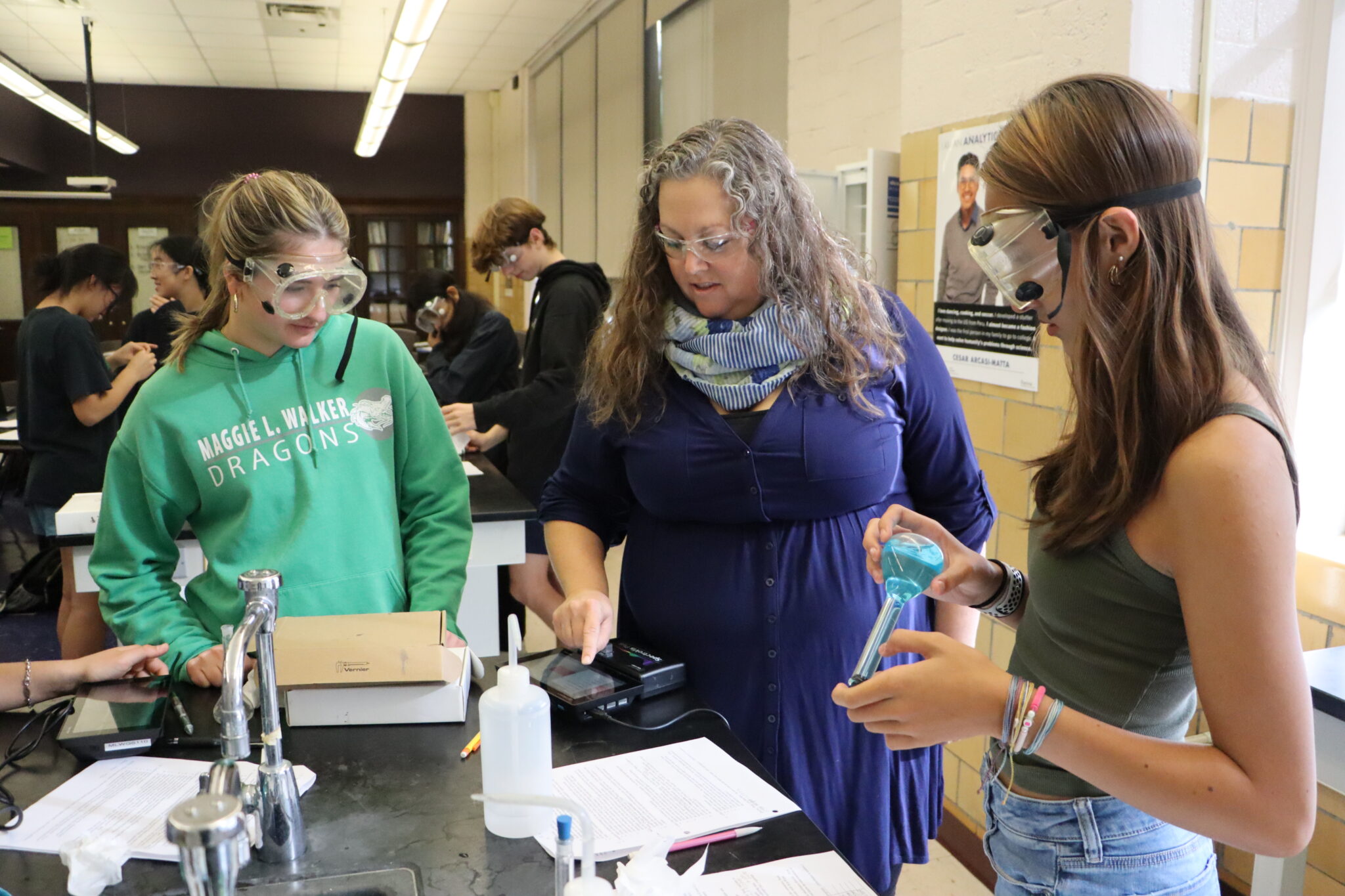 1 teacher and 2 students in chemistry lab