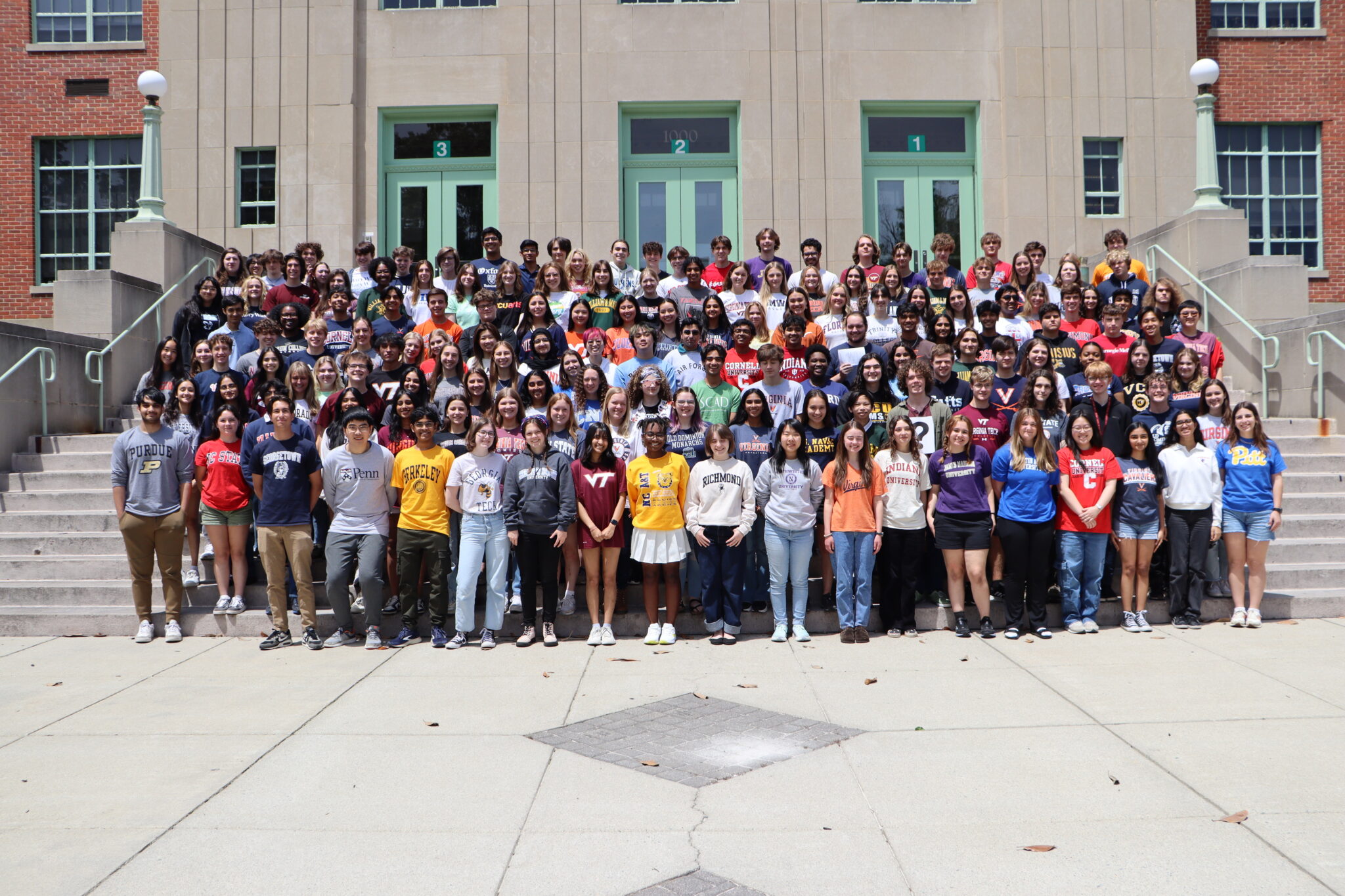 Seniors wearing their college t-shirts